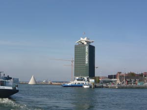 The IJ river seen from a ferry, with the old Shell tower on the north bank